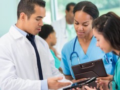physicians conferring on patient transfers